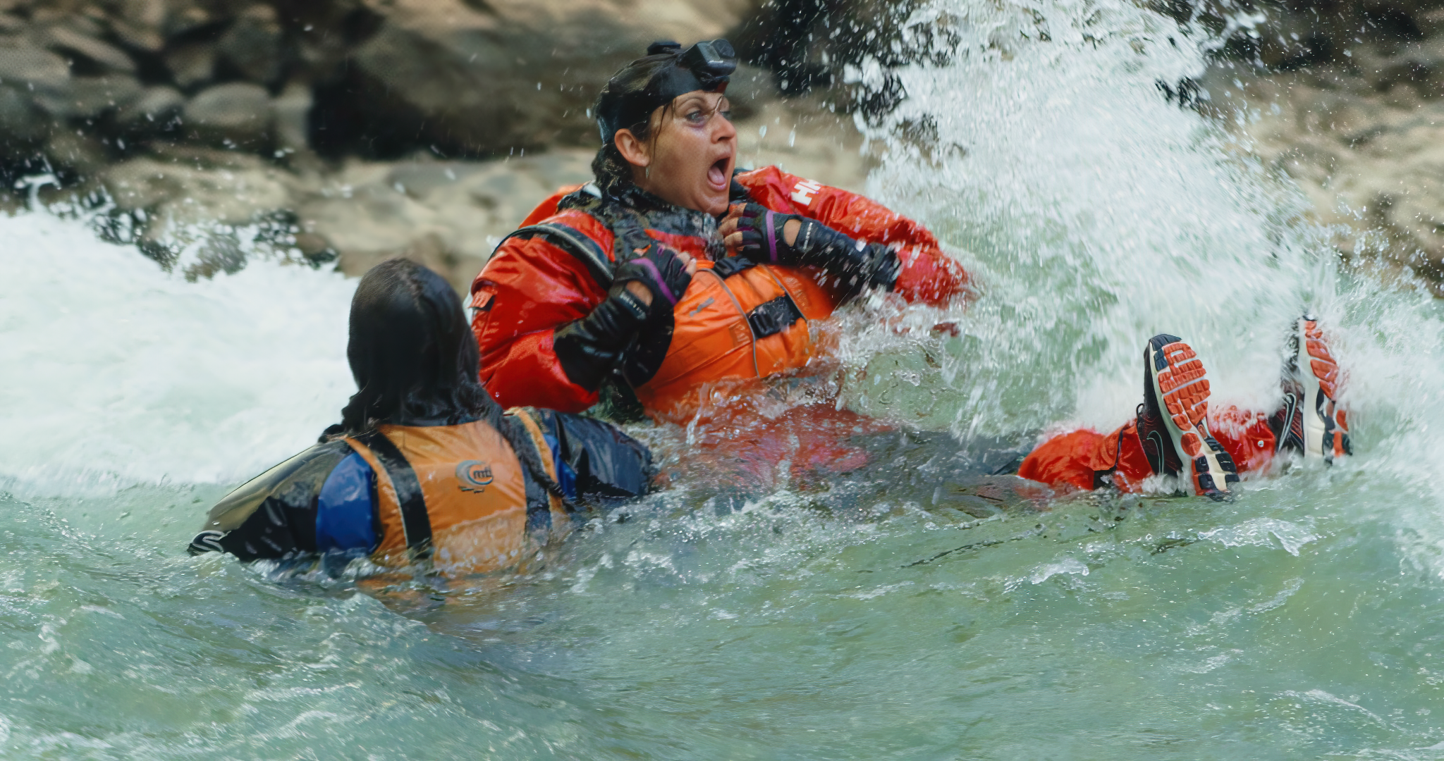 Cara Yar Khan and expedition teammates navigating powerful whitewater in the Grand Canyon.